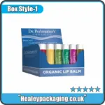 Display box with branded lip balms arranged upright for retail counter presentation