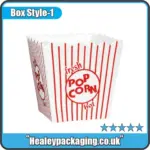 Classic red and white striped custom popcorn box with scalloped edges for serving hot popcorn