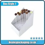 White display-style cake pop box with multiple chocolate and vanilla cake pops upright.
