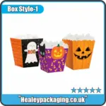 Colourful Halloween popcorn boxes with ghost, pumpkin and cat designs filled with white popcorn