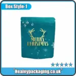 Teal Christmas mylar pouch with gold “Merry Christmas” text and antler design.