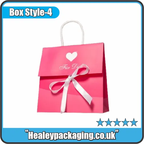 Bright pink gift bag with a white heart logo, white satin bow, and white rope handles.