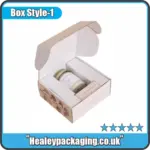 Custom printed candle box with a fitted insert, presented open with a jar candle secured inside.