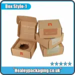 Custom kraft candle boxes with branded printing, stacked to show retail-ready candle packaging design.