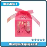 Decorative laser cut gift box with ribbon, designed for wedding favours and special gift packaging.