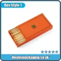 Custom match-style sliding box packaging holding wooden sticks, minimal branded design
