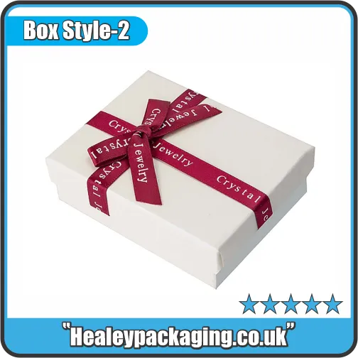 White jewellery gift box wrapped with burgundy ribbon for crystal jewellery packaging