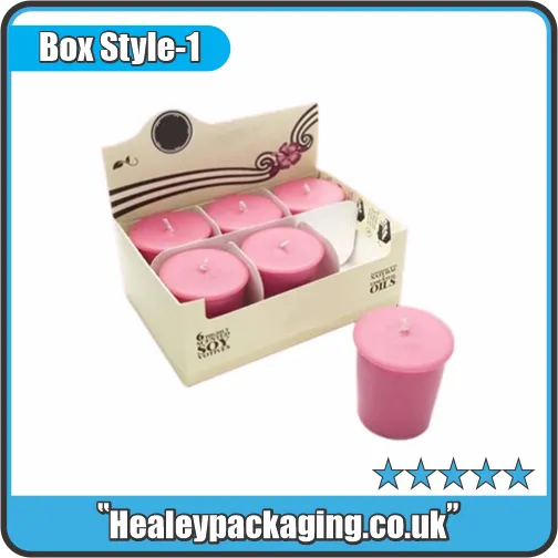 Cardboard candle display box holding pink pillar candles for retail presentation