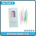 Candle box with window displaying colourful slim candles.