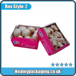 Custom printed produce boxes filled with fresh mushrooms.