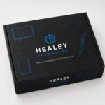 Closed black notebook mailer box featuring blue stationery illustrations