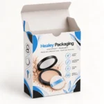 Open cardboard compact powder box with a tuck-in lid and blue and white printed design.