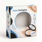 Printed compact powder box with a large circular display window and blue detailing.